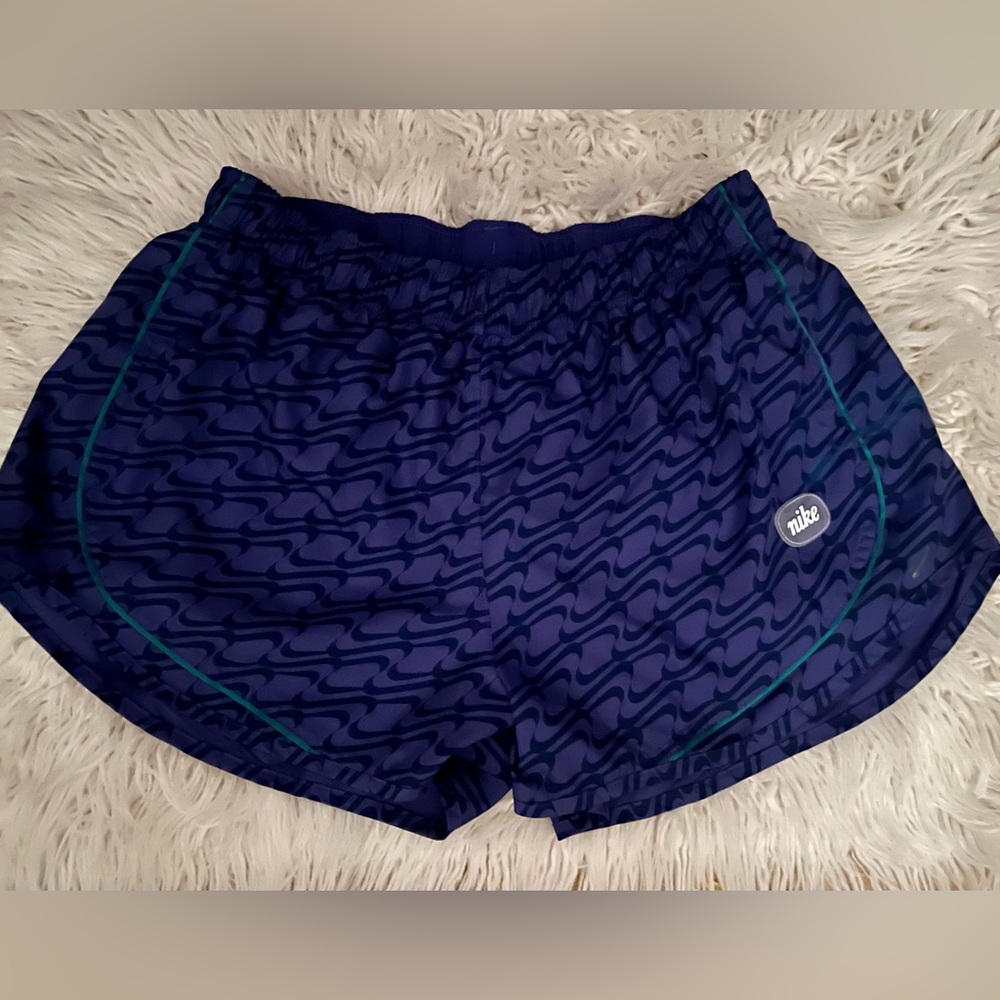 Selling Nike shorts size large beautiful purple color.